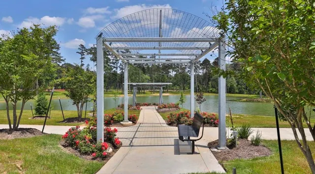a view of a balcony with chairs and floor to ceiling window