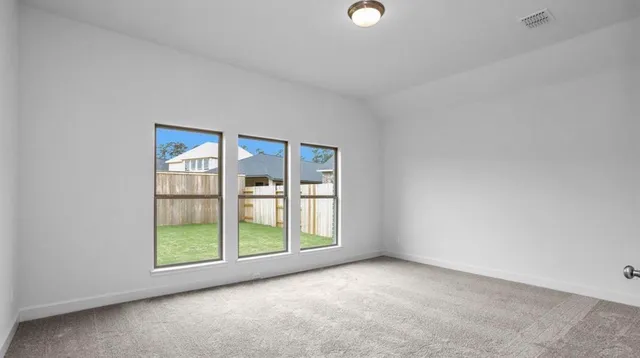 an empty room with windows