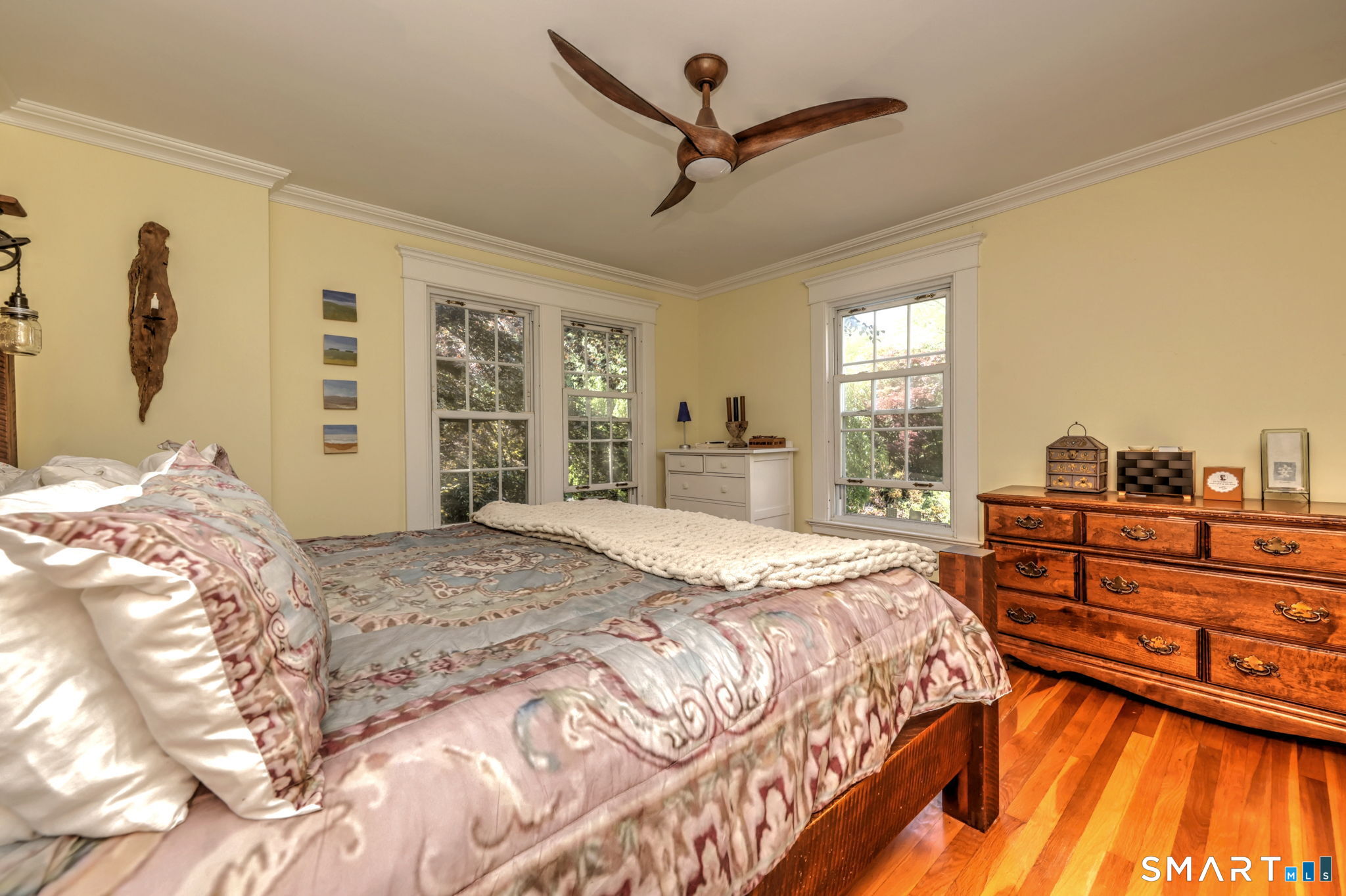 25 Center Road Woodbridge, CT 06525 - Photo 19 of 34 a bedroom with a bed and a dresser with the outer view