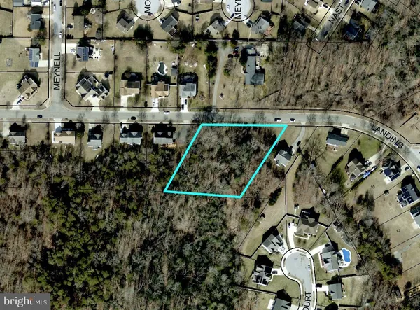 an aerial view of house with parking space