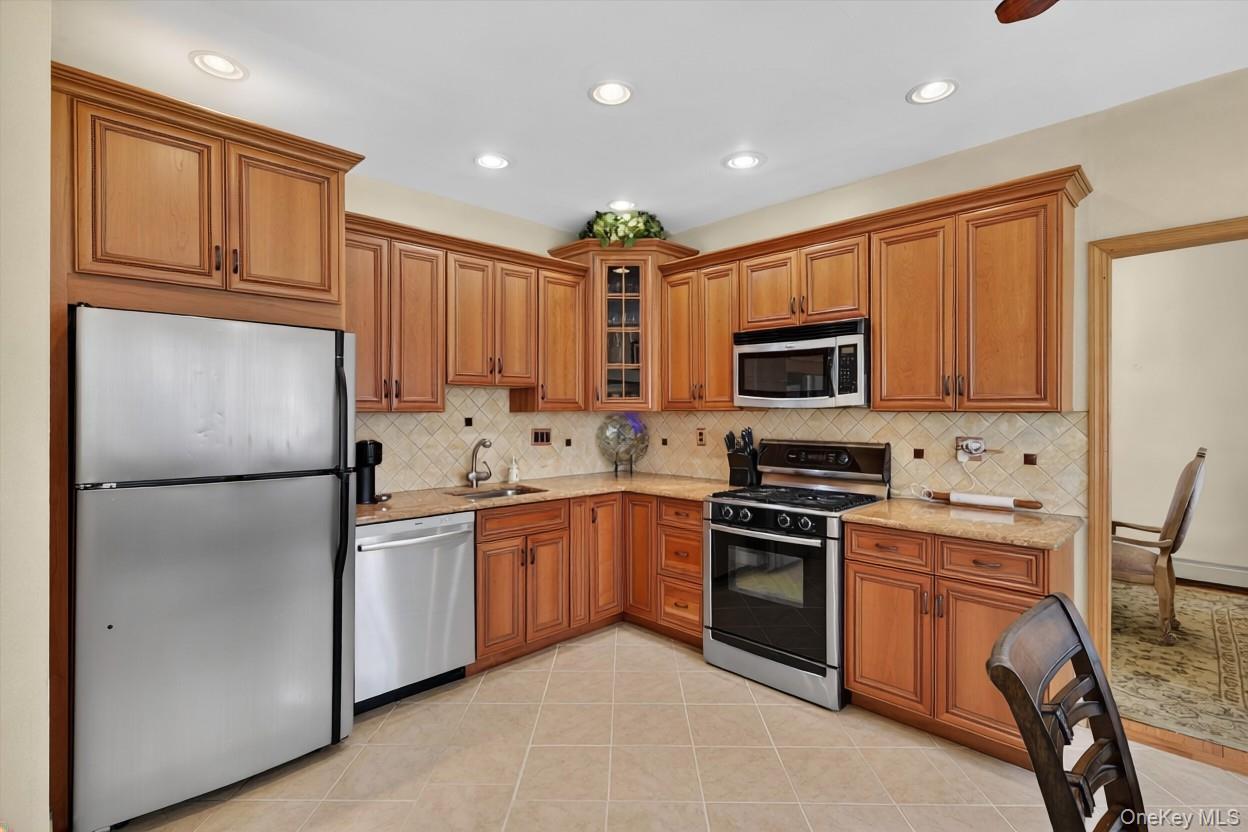 449 West Mombasha Road Monroe, NY 10950 - Photo 7 of 39 a kitchen with stainless steel appliances granite countertop a refrigerator stove microwave and sink