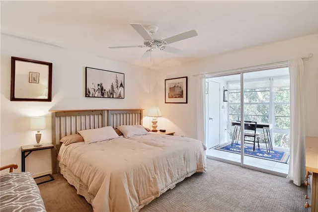 a bed room with a bed and a chair