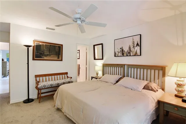 a bedroom with bed and a window