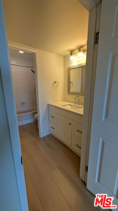 7300 Lennox Avenue, Unit J15 Van Nuys, CA 91405 - Photo 12 of 25 a bathroom with a sink and mirror