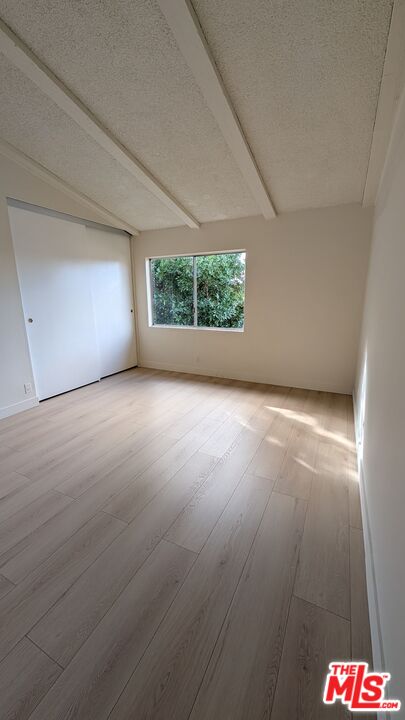7300 Lennox Avenue, Unit J15 Van Nuys, CA 91405 - Photo 14 of 25 an empty room with windows