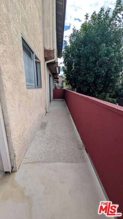 7300 Lennox Avenue, Unit J15 Van Nuys, CA 91405 - Photo 17 of 25 a view of a balcony with an outdoor space