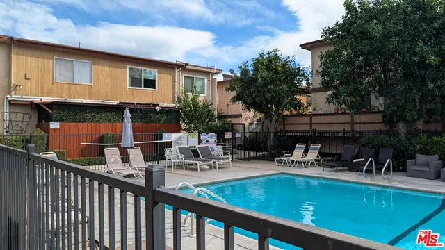 a view of outdoor sitting area with furniture