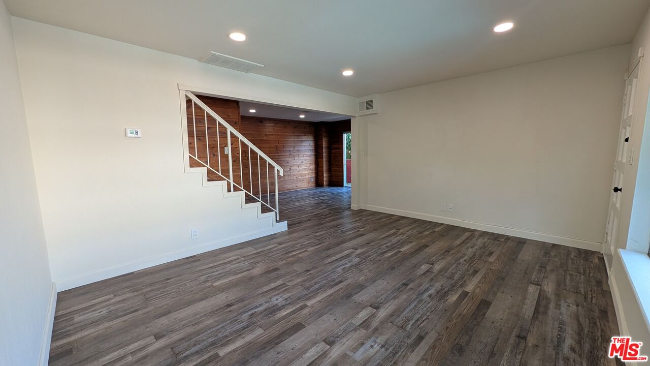 7300 Lennox Avenue, Unit J15 Van Nuys, CA 91405 - Photo 2 of 25 a view of entryway with wooden floor