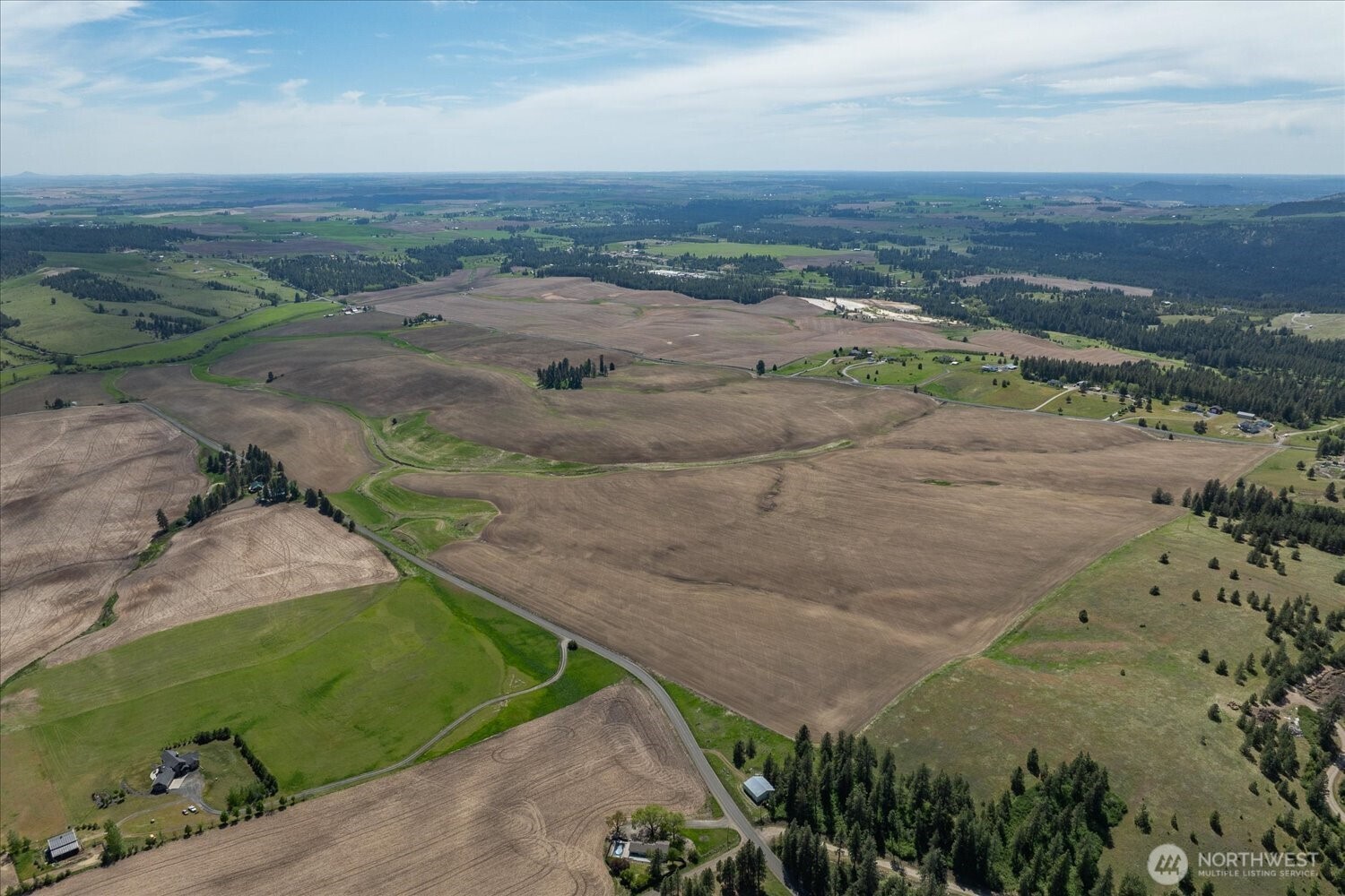 -xxx South Jackson Road, Unit LOT 17 Mica, WA 99023 - Photo 2 of 40 a view of a road with an ocean view