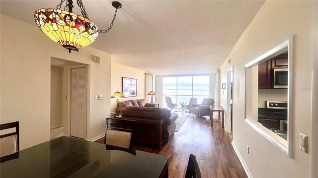 a kitchen with granite countertop cabinets stainless steel appliances and a sink