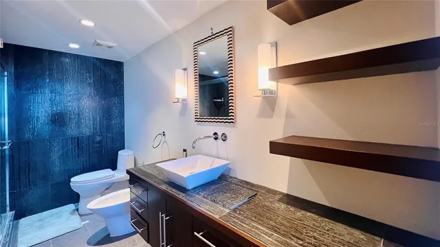 a bathroom with a shower and a sink
