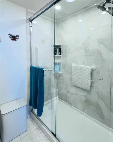 a view of a swimming pool with outdoor seating