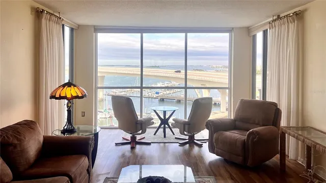 a living room with furniture or couch and a large window