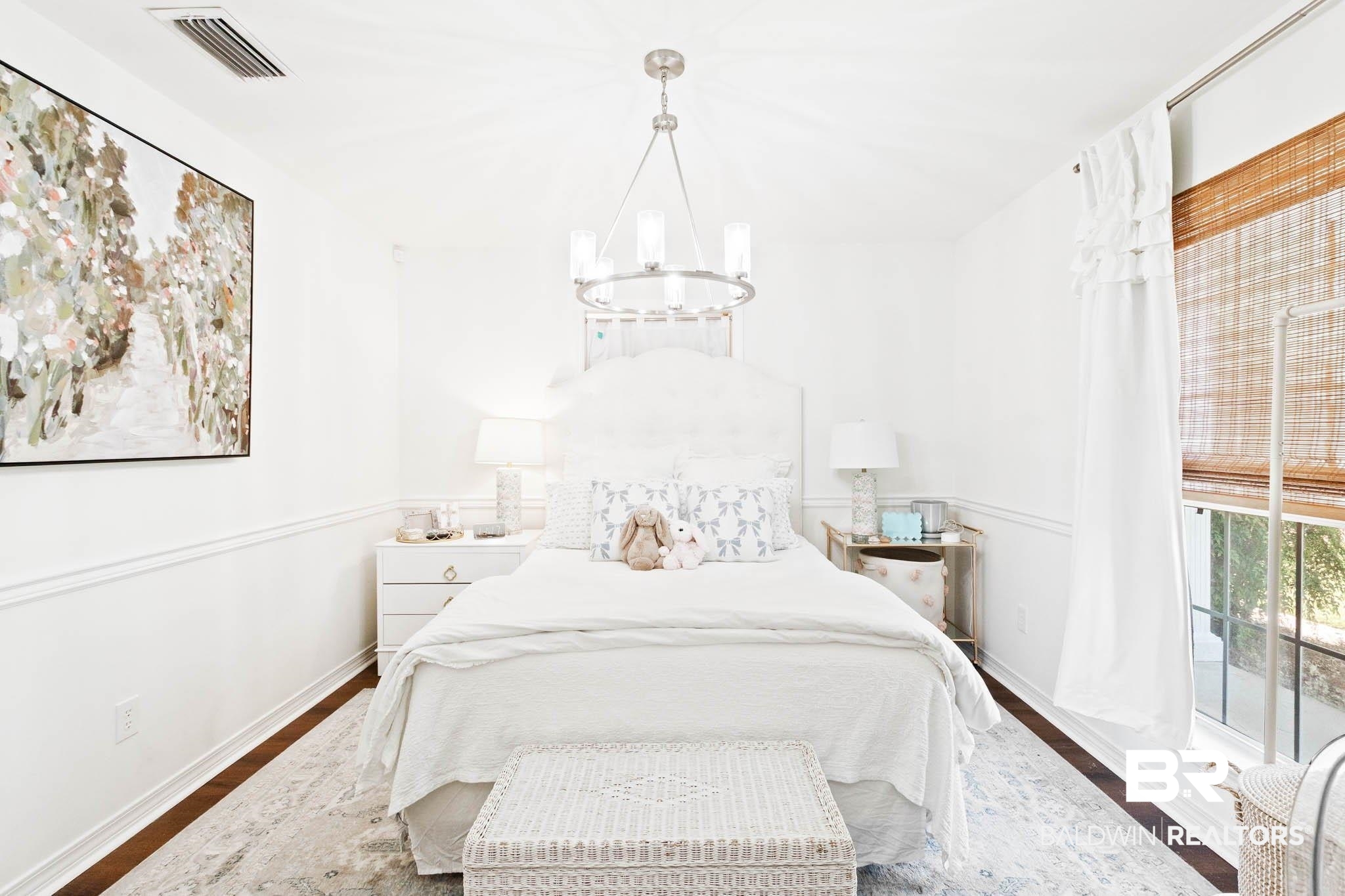 20685 Lowry Drive Fairhope, AL 36532 - Photo 34 of 48 Bedroom featuring wood finished floors and a chandelier