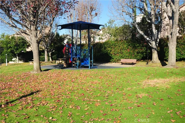 a view of a grassy field with trees