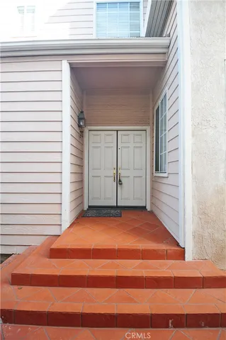 a view of a room that has a large window