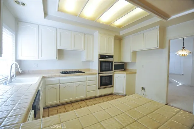 a kitchen with a cabinets and appliances