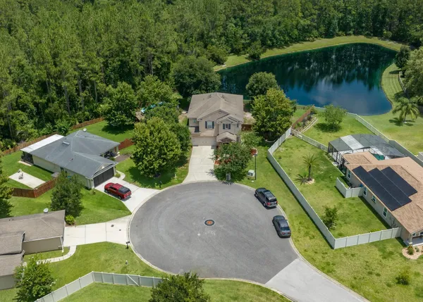 an aerial view of a house having yard