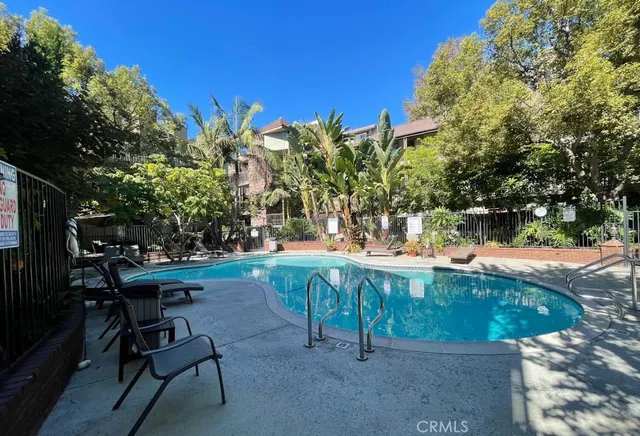 a view of a backyard with sitting area