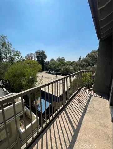 a view of balcony with furniture