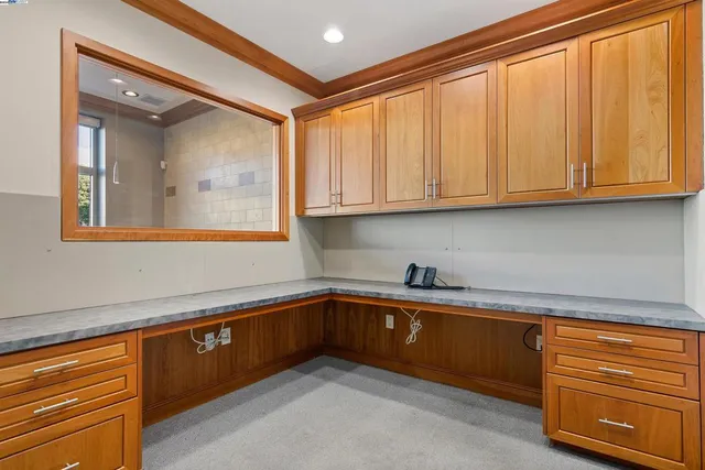 a kitchen with a sink cabinets and window