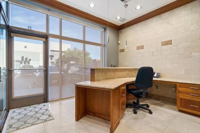 a view of a dining room with furniture water view and a large window