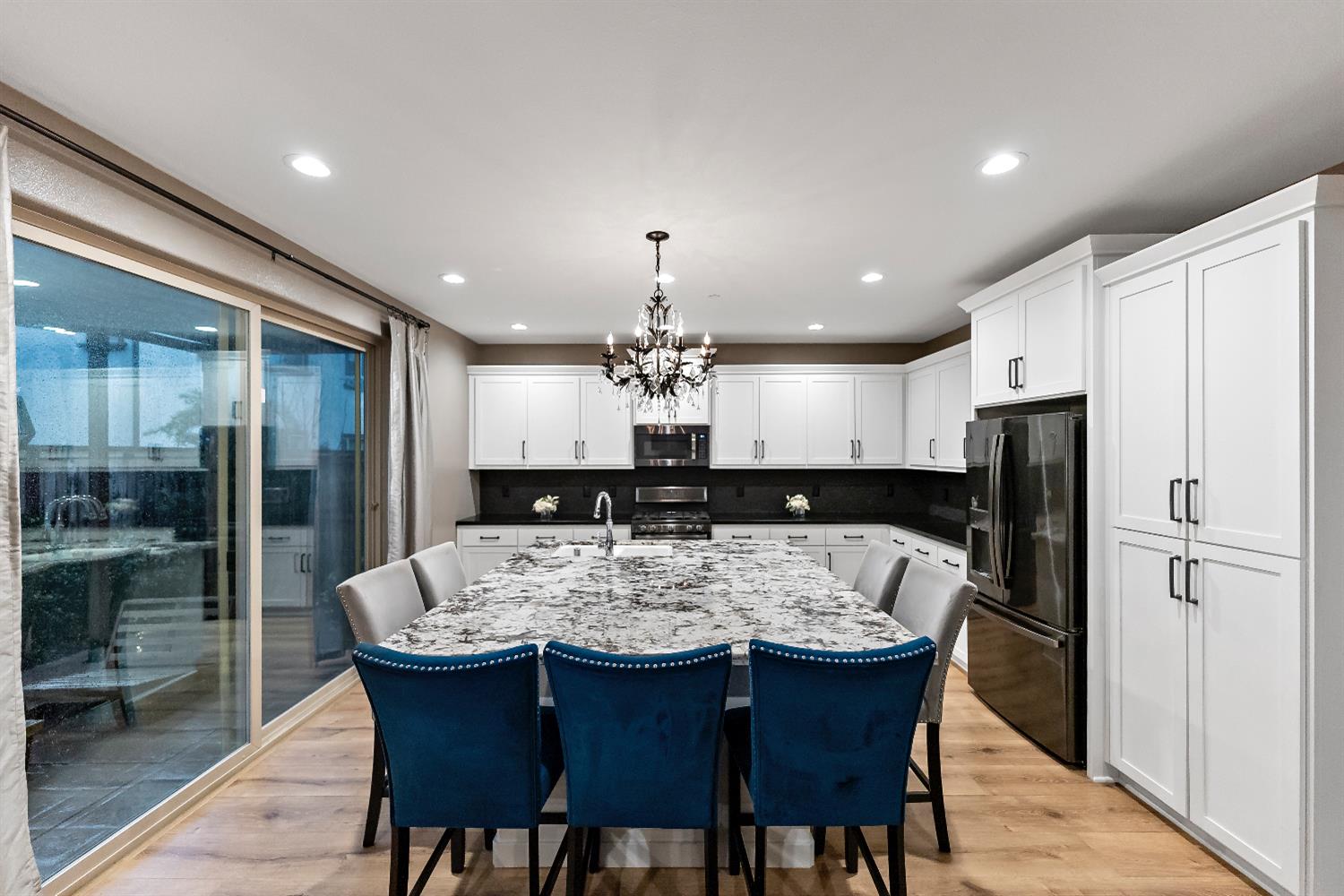 4301 San Miguel Road Madera, CA 93636 - Photo 18 of 20 a large kitchen with a table and refrigerator