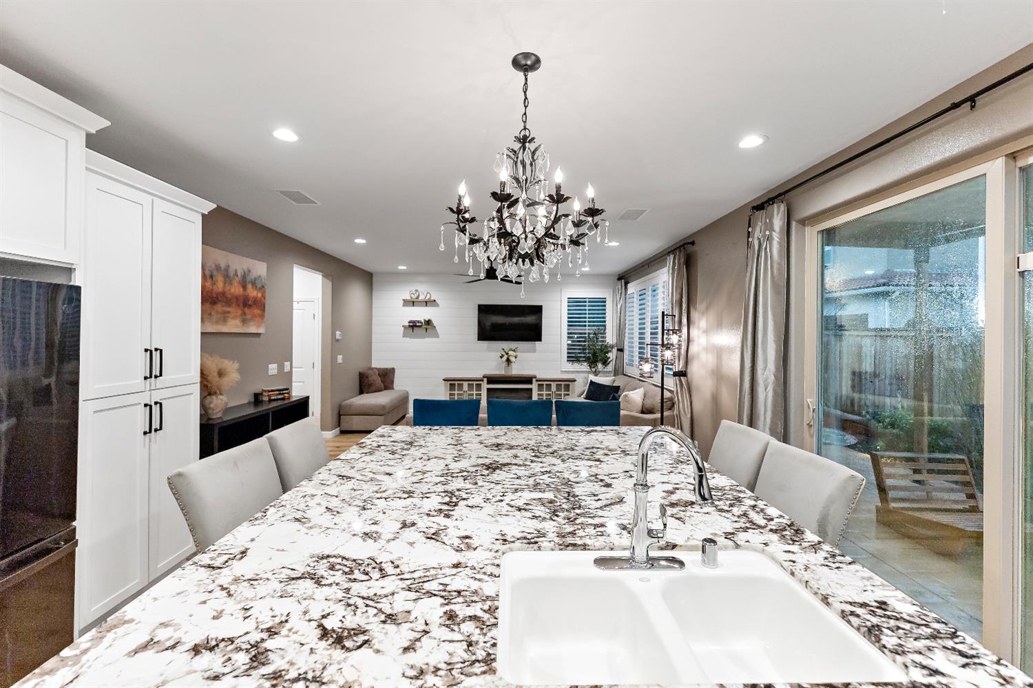 4301 San Miguel Road Madera, CA 93636 - Photo 2 of 20 a large kitchen with kitchen island granite countertop a refrigerator and stove