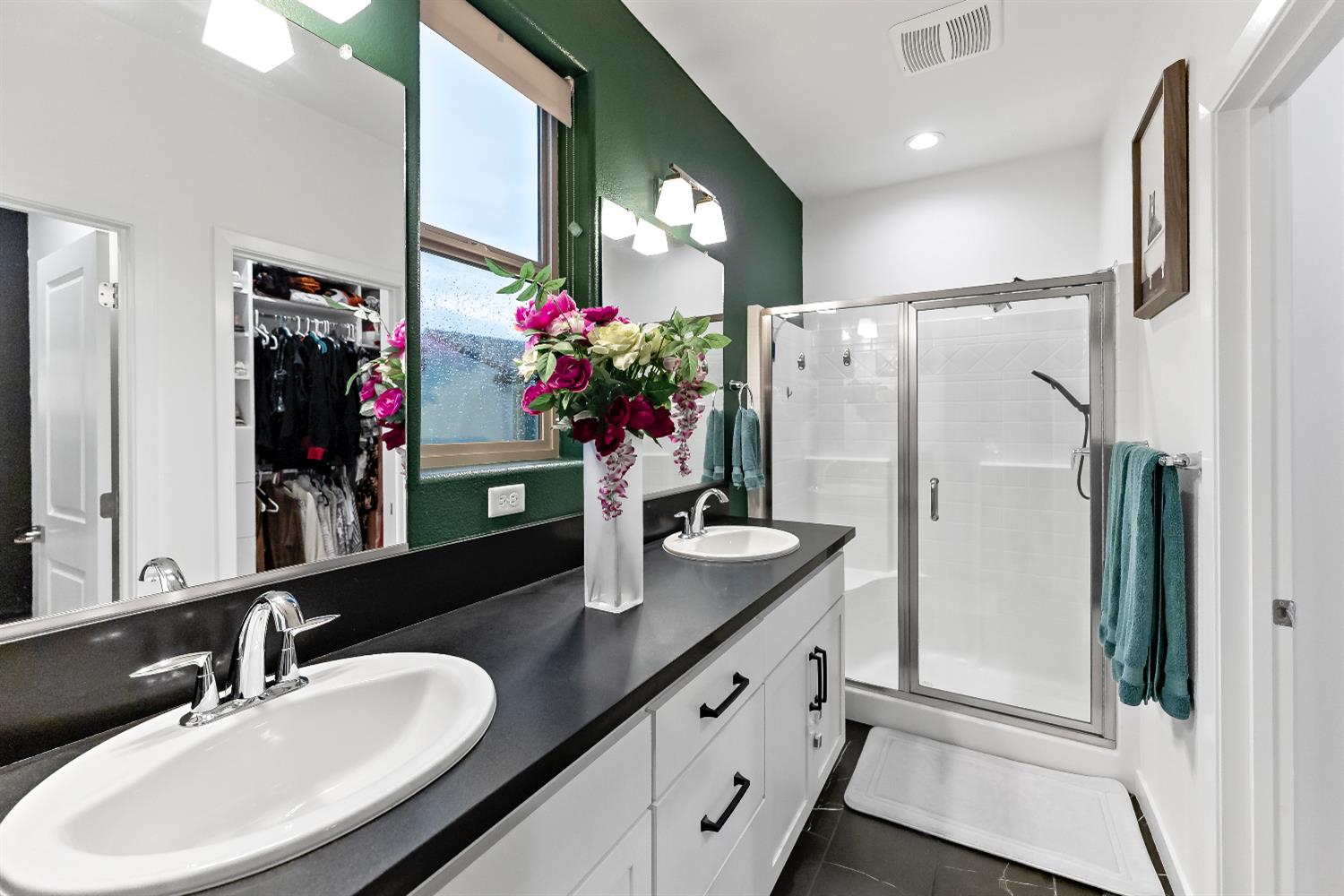 4301 San Miguel Road Madera, CA 93636 - Photo 6 of 20 a bathroom with a sink double vanity and a large mirror