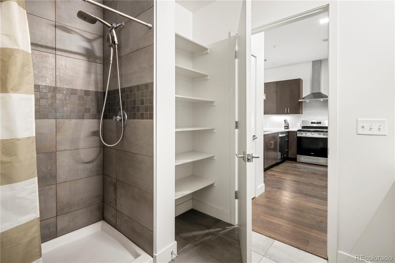 1898 South Bannock Street, Unit 103 Denver, CO 80223 - Photo 14 of 22 a bathroom with a sink and mirror