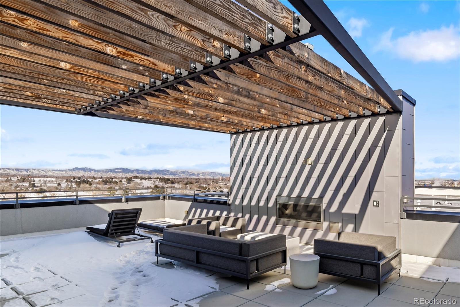 1898 South Bannock Street, Unit 103 Denver, CO 80223 - Photo 20 of 22 a view of a couches with wooden floor
