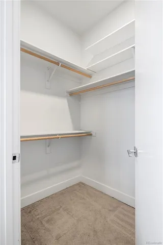 a view of an empty walk in closet