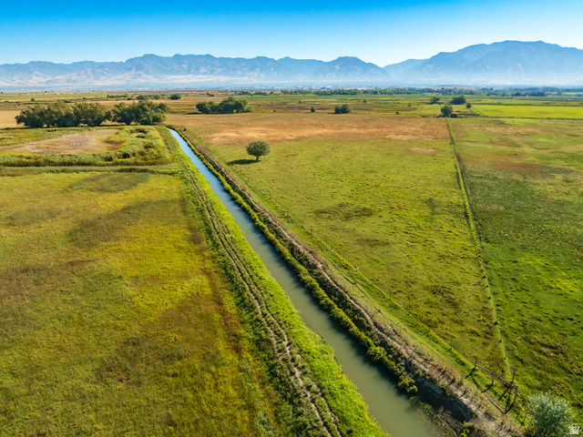 100 South 3600 West Logan, UT 84321 - Photo 6 of 10 Overview of rural landscape featuring a pastoral area and a water and mountain view