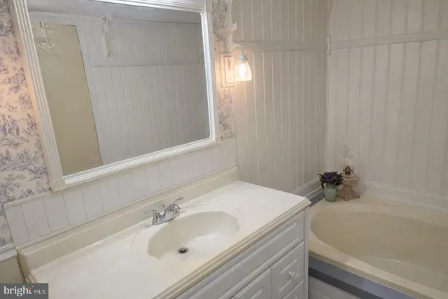 a bathroom with a sink and a bathtub