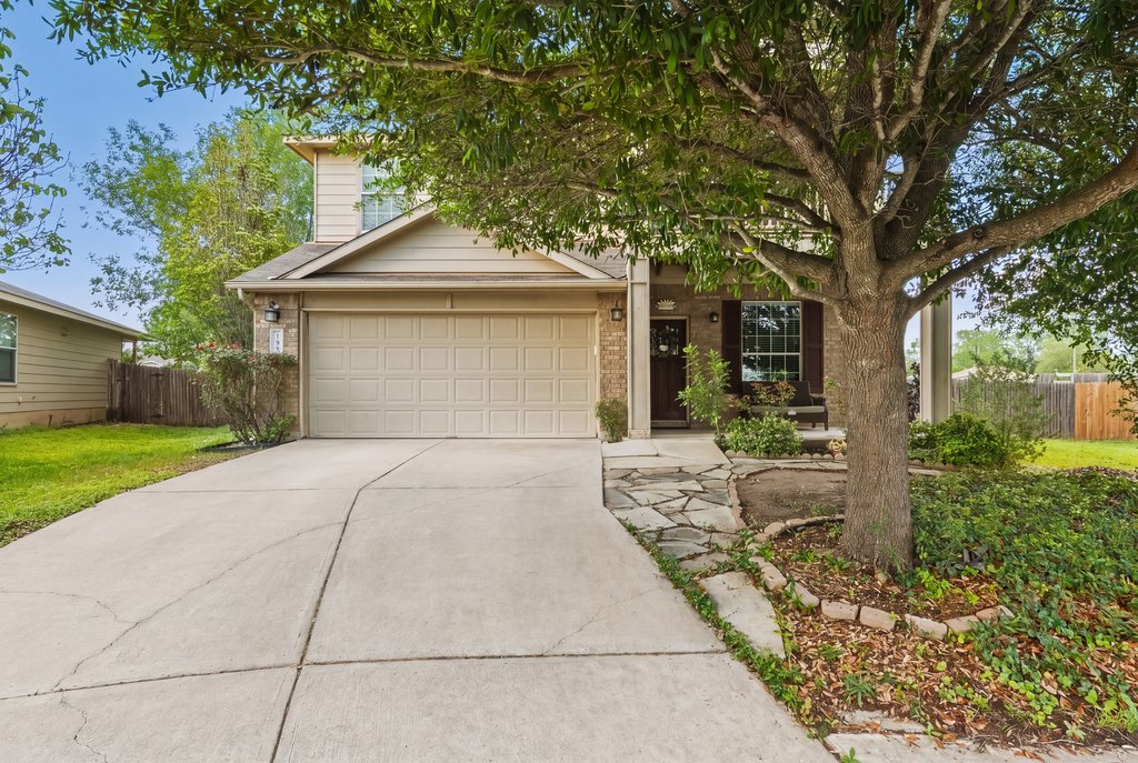 140 Wolfberry Path Buda, TX 78610 - Photo 35 of 35 a front view of a house with garden