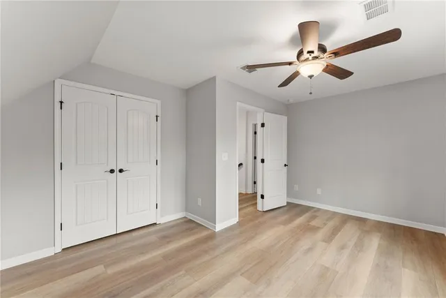 a view of an empty room and wooden floor