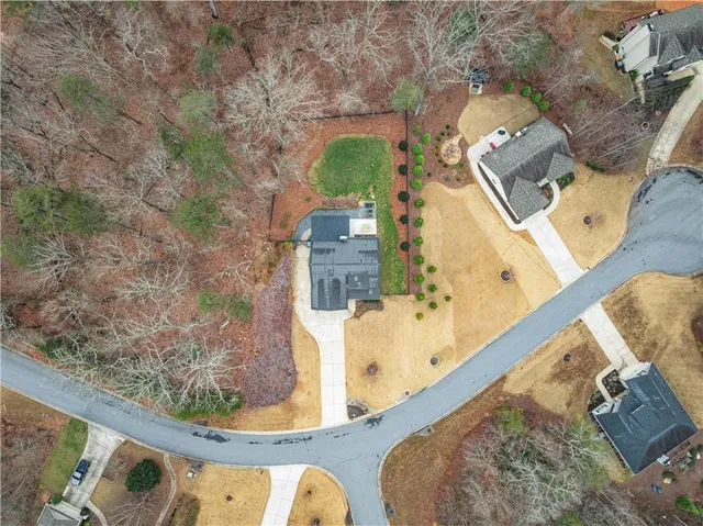 an aerial view of a house with outdoor space