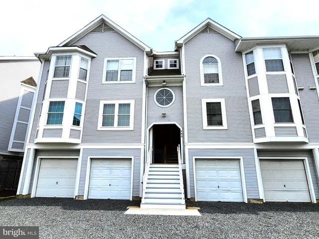 a front view of a house with a large window