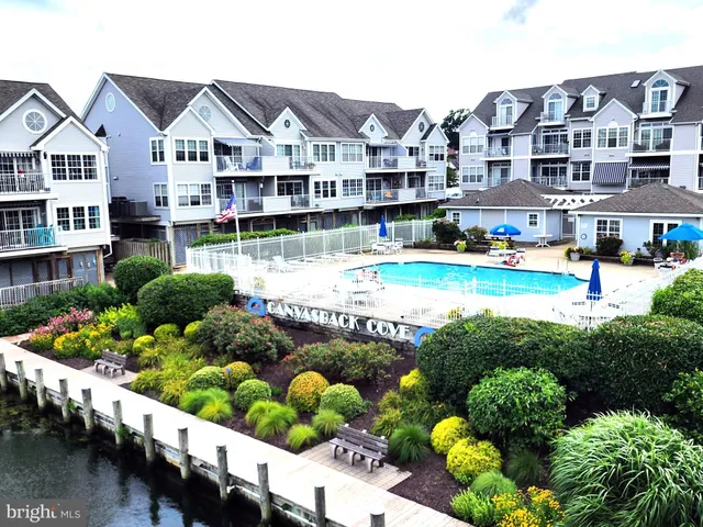 a front view of a house with a yard table and chairs