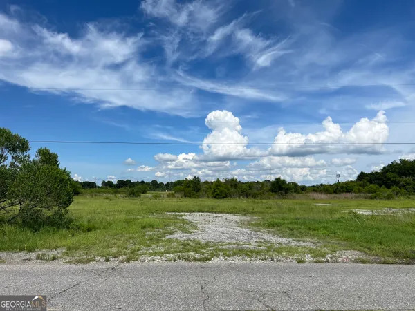 a view of a lake with a big yard