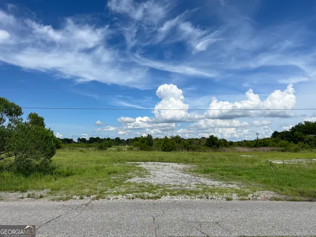 a view of a lake with a big yard