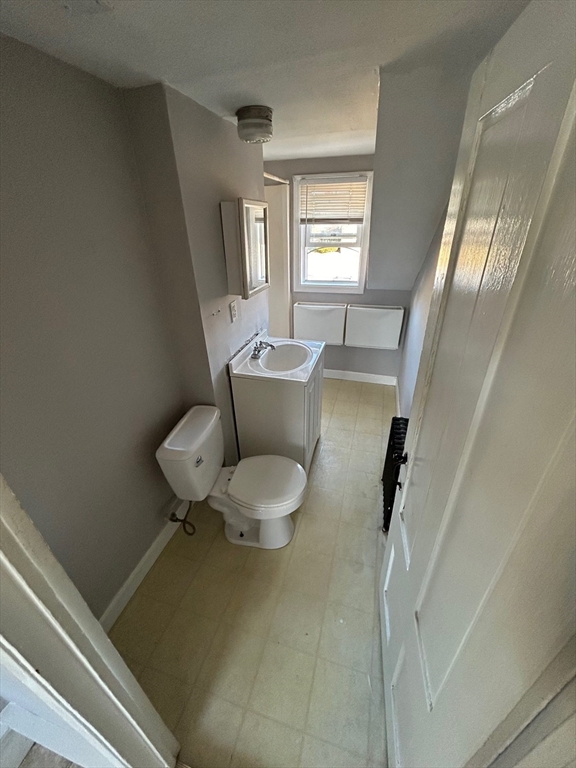 441 King Street, Unit G Littleton, MA 01460 - Photo 7 of 7 a living room with furniture and a window