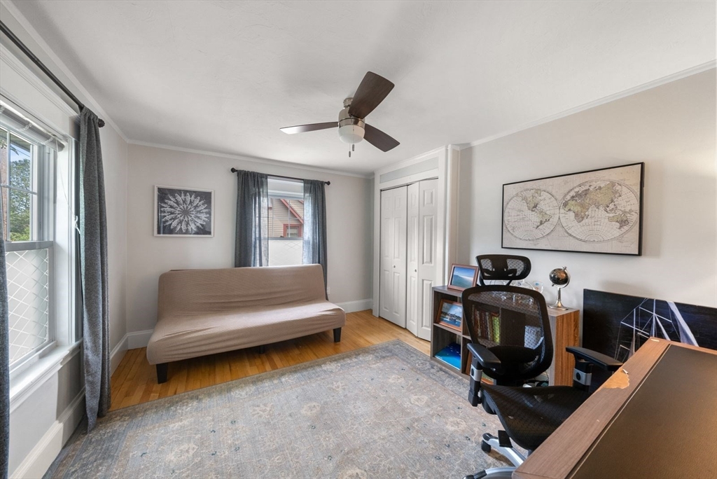 1111 Brook Road Milton, MA 02186 - Photo 11 of 22 a living room with furniture gym equipment and a window