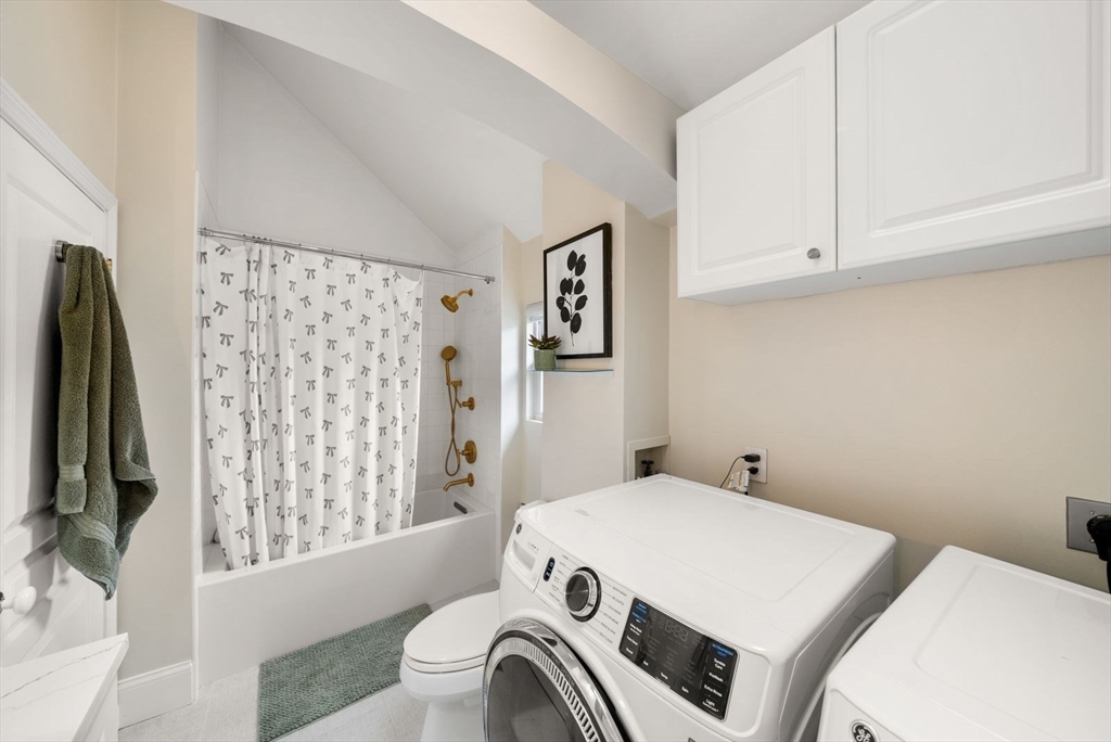 1111 Brook Road Milton, MA 02186 - Photo 14 of 22 a bedroom with a bed and a flat screen tv