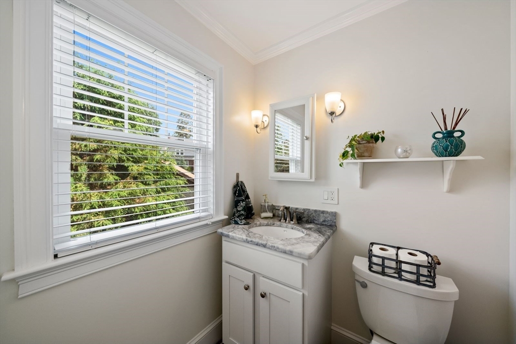 1111 Brook Road Milton, MA 02186 - Photo 15 of 22 a bathroom with a granite countertop sink and a toilet