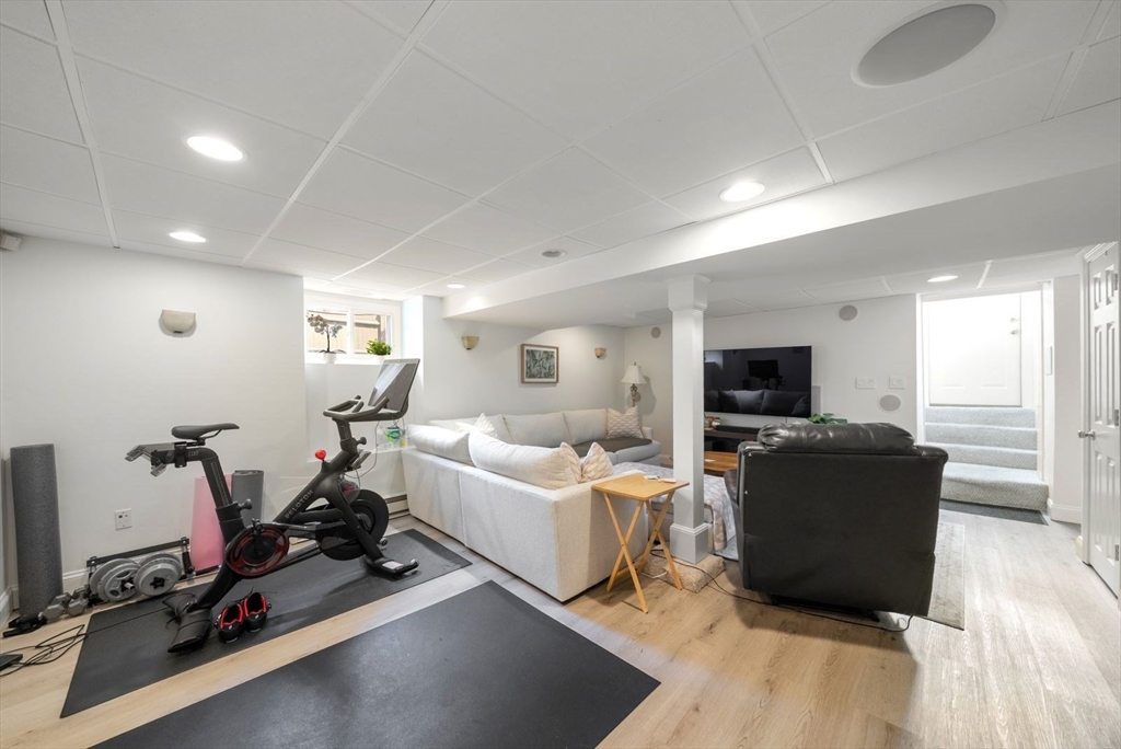1111 Brook Road Milton, MA 02186 - Photo 16 of 22 a living room with furniture and a flat screen tv