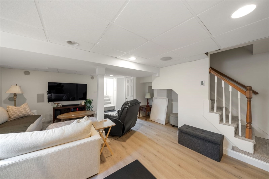 1111 Brook Road Milton, MA 02186 - Photo 17 of 22 a living room with furniture and a flat screen tv