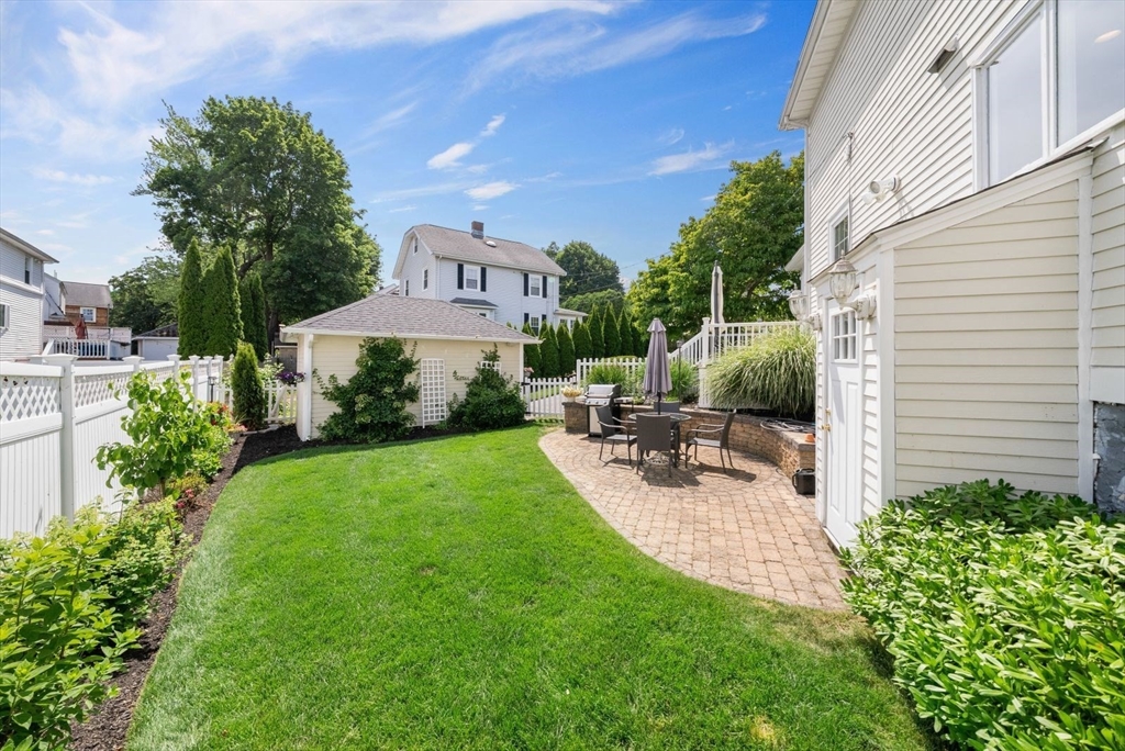 1111 Brook Road Milton, MA 02186 - Photo 18 of 22 a view of backyard with a patio and garden