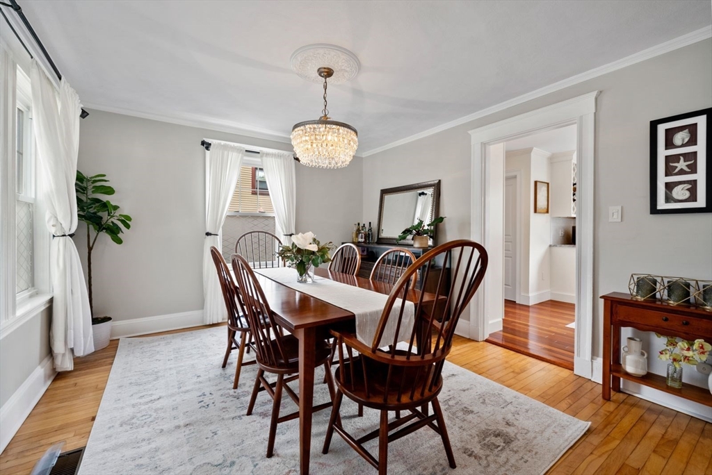 1111 Brook Road Milton, MA 02186 - Photo 6 of 22 a view of a dining room with furniture window and wooden floor