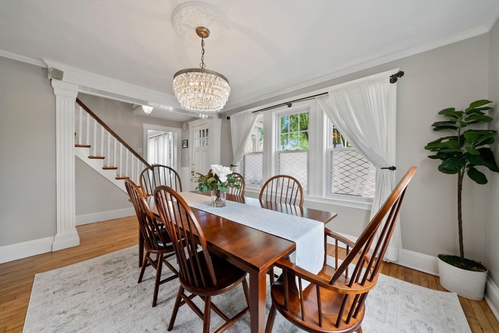 1111 Brook Road Milton, MA 02186 - Photo 7 of 22 a view of a dining room with furniture window and wooden floor